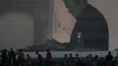 An image of Barcelona's head coach Ronald Koeman appears on a screen after the La Liga match between Atletico Madrid and Barcelona at the Wanda Metropolitano in Madrid, Saturday, October 2, 2021. Atletico won the match 2-0. AP Photo