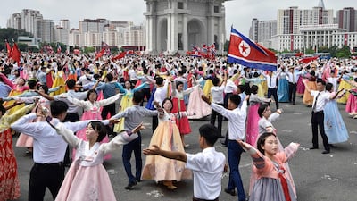 Dancers mark the 73rd anniversary of the end of the Korean War at the plaza of the Arch of Triumph in Pyongyang. AFP