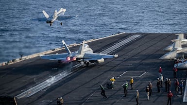 Jets launch from the flight deck of the USS Abraham Lincoln. AFP / US Navy / Navcent Public Affairs