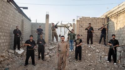 TUZ KHORMATU, IRAQ: Goran Gowhar, a Kurdish tribal leader, poses with his militia.
