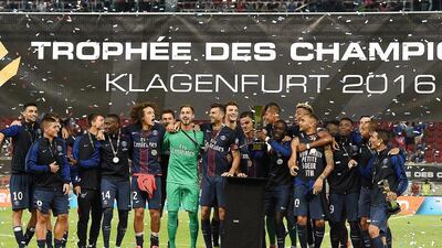 Players of Paris Saint-Germain celebrate after winning the Trophee des Champions ‘super cup’ match between PSG and Lyon in Klagenfurt, Austria, on August 6, 2016. Boris Horvat / AFP