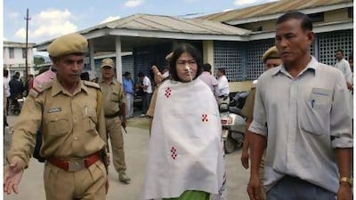 Irom Sharmila, centre, who has been on a decade-long hunger strike protesting against an anti-terror law that grants Indian soldiers sweeping powers in the northeastern state of Manipur, comes out after a court hearing in Imphal. Bullu Raj / AP Photo