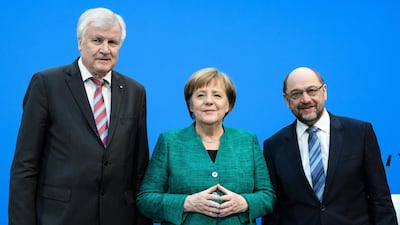 Horst Seehofer (L) Angela Merkel and Martin Schulz have concluded coalition talks that leaves the Chancellor in power, but weaker. EPA/CLEMENS BILAN