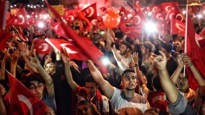 People gather to celebrate in Istanbul’s Taksim Square, in July, after the failed military coup in which 290 people died. Kursat Bayhan / Getty Images.