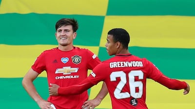 Manchester United's Harry Maguire, left, celebrates scoring the winner in their extra-time victory against Norwich City in the FA Cup quarter-final clash at Carrow Road on Sunday, June 27. Reuters