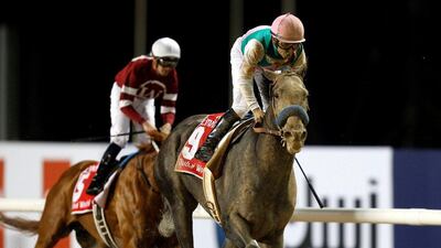 Mike Smith rides Arrogate to the finish line, beating Gun Runner (in the background) who came in second. Ahmed Jadallah / Reuters