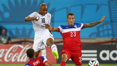 Andre Ayew, No 10, of Ghana shoots and scores past John Brooks and Fabian Johnson of the United States during their 2014 Fifa World Cup Group G match at Estadio das Dunas on June 16, 2014, in Natal, Brazil. Robert Cianflone / Getty Images