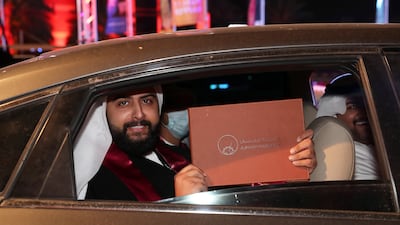 Fares Ali celebrates after collecting his degree certificate