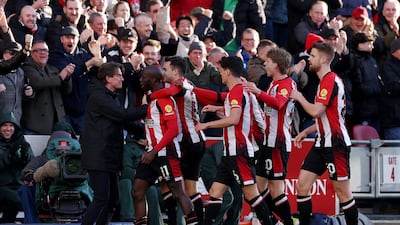 Yoane Wissa of Brentford celebrates with teammates and manager Thomas Frank after scoring his team's second goal. Getty Images