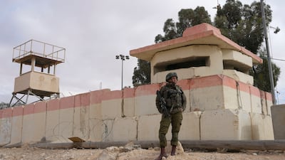 An Israeli soldier stands guard at the Nitzana border crossing with Egypt. AP