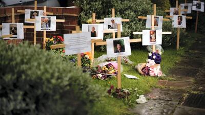As the UK passes 100,000 deaths, here's a look back at some of the most poignant moments of the pandemic. Photographs and memorials for those who died during the pandemic sit outside Riverside Church in Burton-on-Trent, England. The 13 crosses include three members from the same family: Jayne Harvey, 62, died from Covid-19 after nursing her parents Keith and Jean McVicar through the virus. Getty Images