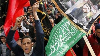 Palestinians chant slogans during a protest over the detention of Khader Adnan, 33, who has been on hunger strike for 65 days to protest what he says is the humiliation that he faces in Israel's military justice system. He is being held in "administrative detention," under which an Israeli military judge can imprison Palestinians for six-months without charge.