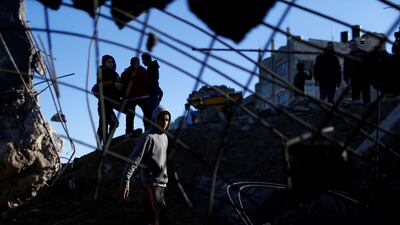 Palestinians inspect the site of an Israeli air strike in Gaza City. Reuters