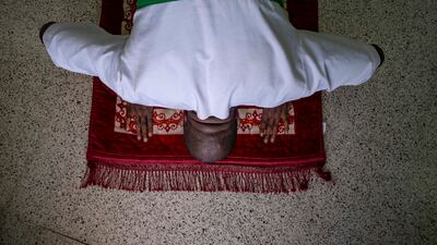 An inmate who converted to Islam three months ago prays at a jail in Dubai. All photos: Antonie Robertson / The National
