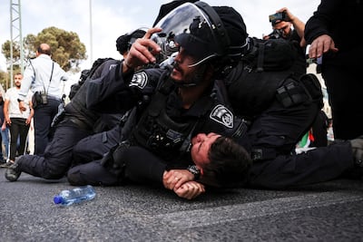 Israeli security forces detain a Palestinian protester near the house of Al Jazeera reporter Shireen Abu Akleh who was killed in an Israeli raid in Jenin in the occupied West Bank, in Jerusalem. Reuters