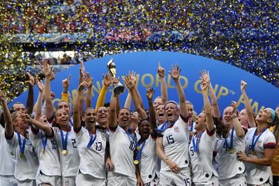 USA's players celebrate with the Women's World Cup trophy after the France 2019 final. AFP