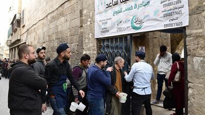 'Food is offered to anyone who comes with pots and containers to be filled up,' says Saaed founder Essam El Habal. AFP