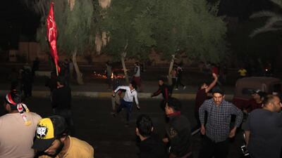 Iraqi protesters throw stones towards the Iranian counsulate during a protest in Karbala, Iraq, 03 November 2019. EPA