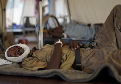 An injured Sudanese man who fled violence in the Darfur city of El Fasher. Reuters