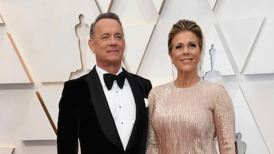 Tom Hanks, wearing Tom Ford, and Rita Wilson arrive at the Oscars on Sunday, February 9, 2020, at the Dolby Theatre in Los Angeles. AP