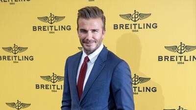 David Beckham, in a deep blue suit, attends the opening of the Breitling Boutique on June 3, 2015 in Madrid, Spain. Getty Images