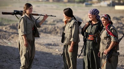 Female Kurdistan Workers Party (PKK) troops patrolling on the front line in the Makhmur area, near Mosul, during the ongoing conflict against ISIL militants. Ahmad Al Rubaye / AFP