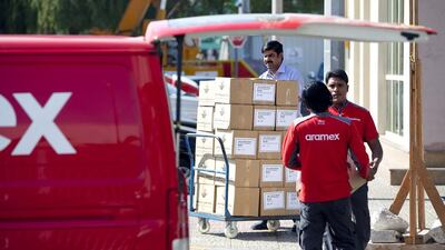 People walk out of Aramex branch in Abu Dhabi. Silvia Razgova / The National