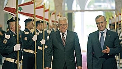 Michel Suleiman, the Lebanese president, right, and the visiting Palestinian president, Mahmoud Abbas, review the guard of honour yesterday at the presidential palace in Baabda, east of Beirut.