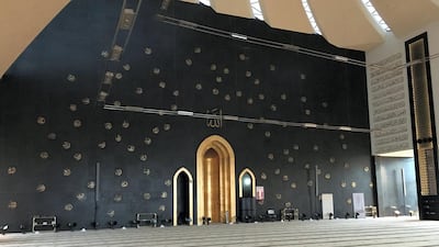 The Qibla wall of Sheikha Fatima bint Mubarak Mosque, in Mohamed bin Zayed city, is painted with the 99 names of Allah.