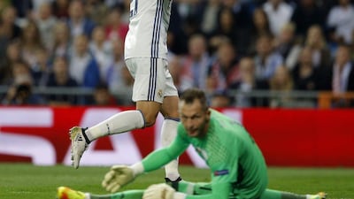 Real Madrid’s Alvaro Morata celebrates past Legia goalkeeper Arkadiusz Malarz. Francisco Seco / AP Photo