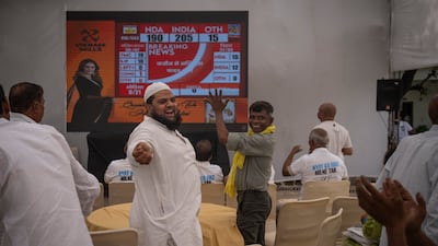 Congress party supporters cheer as they watch votes being counted on television at their party headquarters in New Delhi. AP