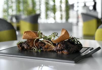 Jerk barbecue wings are a bestseller at Kingston 21. Khushnum Bhandari / The National