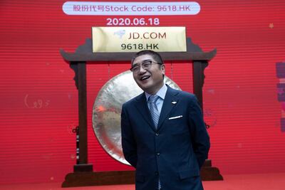 Xu Lei, head of JD Retail, reacts before the ceremony to mark the listing of JD.com. AP