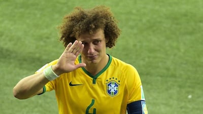 David Luiz waves a tearful good-bye as he walks off the pitch following Brazil's 7-1 loss to Germany in the 2014 World Cup semi-finals on Tuesday in Belo Horizonte, Brazil. Gabriel Bouys / AFP / July 8, 2014