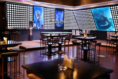 The new rules govern entertainment and serving hours in bars and restaurants. Pawan Singh / The National