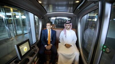 Karim Karam, left, a professor of engineering systems management, and Hamad Al Raqbani, a research engineer, in a driverless vehicle at the Masdar Institute in Abu Dhabi. Driverless cars could be on the roads of the UAE by Expo 2020. Christopher Pike / The National