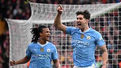 Manchester City's John Stones celebrates scoring the opening goal against Liverpool. AFP