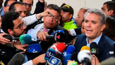 Colombian presidential candidate Ivan Duque speaks to the press at a polling station in Bogota during the first round of the presidential election in Colombia. Luis Acosta / AFP