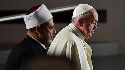 Pope Francis and the Grand Imam of Al Azhar arrive at the Founders Memorial. AFP
