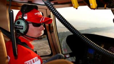 The Formula One world champion Kimi Raikkonen tours Yas Island circuit, which will host the capital's first grand prix in November next year, in a helicopter yesterday.