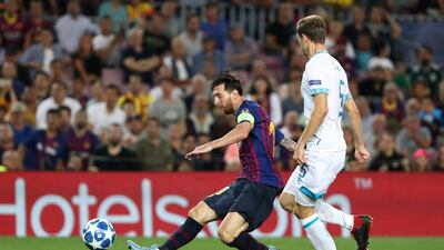 Barcelona's Lionel Messi scores their fourth goal to complete his hat-trick. Reuters