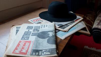 A selection of newspapers and hat is displayed in a recreation of Jimi Hendrix’s bedroom as it is displayed as part of the Handel and Hendrix exhibition. Ben Pruchnie / Getty Images