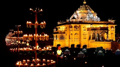The Akshardham Mandir is seen illuminated with some 10,000 oil lamps on the eve of Diwali festival, in Gandhinagar, some 30 kms from Ahmedabad, India. AFP