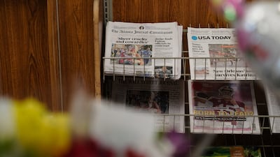 A print copy of the Atlanta Journal-Constitution on a newspaper rack inside a supermarket in Atlanta. For most media organisations around the world, print became one method of distribution, rather than 'the' method of distribution, a long time ago. AFP