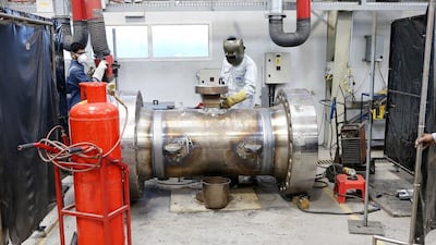 Workers at the Weir Group plant, which deals in oilfield products. Pawan Singh / The National