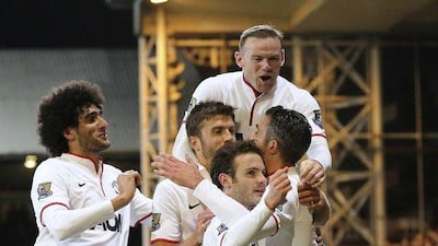 Manchester United players celebrate Robin Van Persie's goal against Crystal Palace during their English Premier League soccer match at Selhurst Park in London February 22, 2014. REUTERS/Paul Hackett