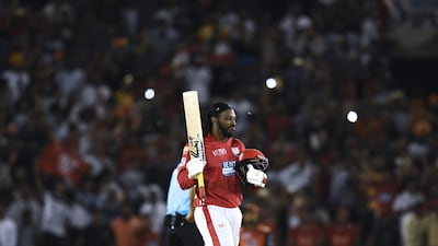 Kings XI Punjab cricketer Chris Gayle celebrates his century (100 runs) during the 2018 Indian Premier League (IPL) Twenty20 cricket match between Kings XI Punjab and Sunrisers Hyderabad at The Punjab Cricket Association Stadium in Mohali on April 19, 2018. / AFP PHOTO / CHANDAN KHANNA / ----IMAGE RESTRICTED TO EDITORIAL USE - STRICTLY NO COMMERCIAL USE----- / GETTYOUT