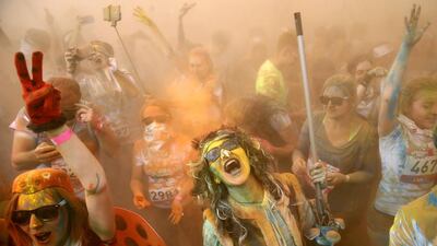 Runners celebrate completing Moscow’s 2017 Colour Run at the Luzhniki Olympic Complex. Maxim Zmeyev / AFP Photo