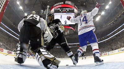 Tomas Plekanec, right, of the Montreal Canadiens celebrates a goal against the PIttsburgh Penguins on Tuesday night in his teams win in the NHL. Justin K Aller / Getty Images / AFP / October 13, 2015