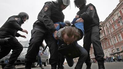 Russian police detain a protester at a demonstration against President Vladimir Putin in St.Petersburg, Russia, Saturday, May 5, 2018. Dmitri Lovetsky / AP